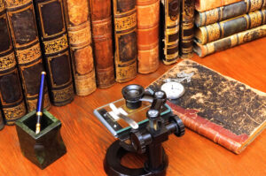 Books and antique microscope